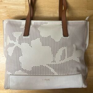 Fossil Madison leather tote bag in the color coconut perforated floral pattern.